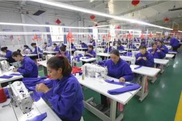Uyghur women work in factory